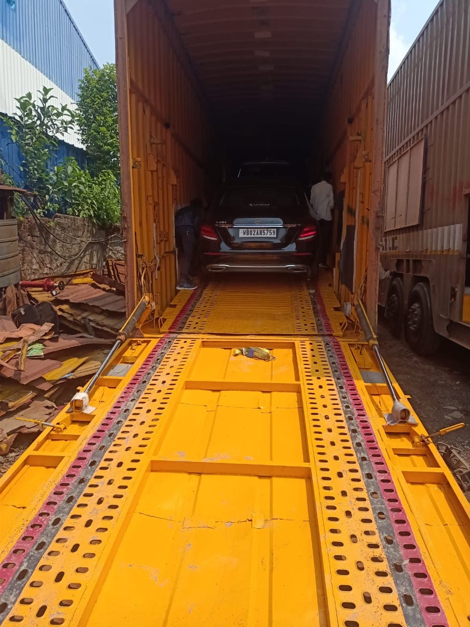 Vehicle being prepared for enclosed transport